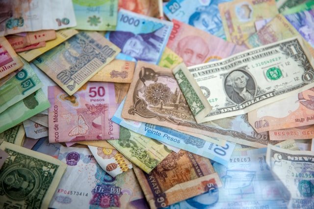 Foreign traveler holding passport while opening bank account in South America 2026