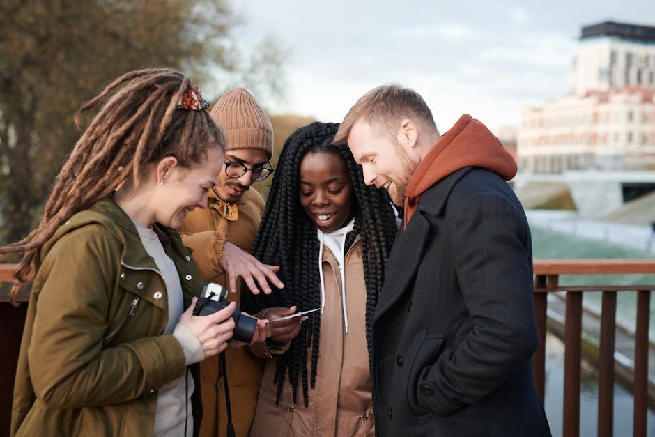 Friends sharing a moment outdoors in winter attire, smiling and happy.